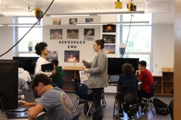 Ms. Blandford assists a student in Aerospace Engineering class. 