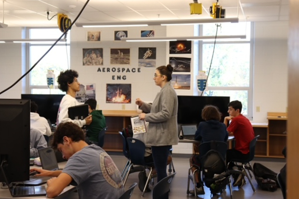 Ms. Blandford assists a student in Aerospace Engineering class. 