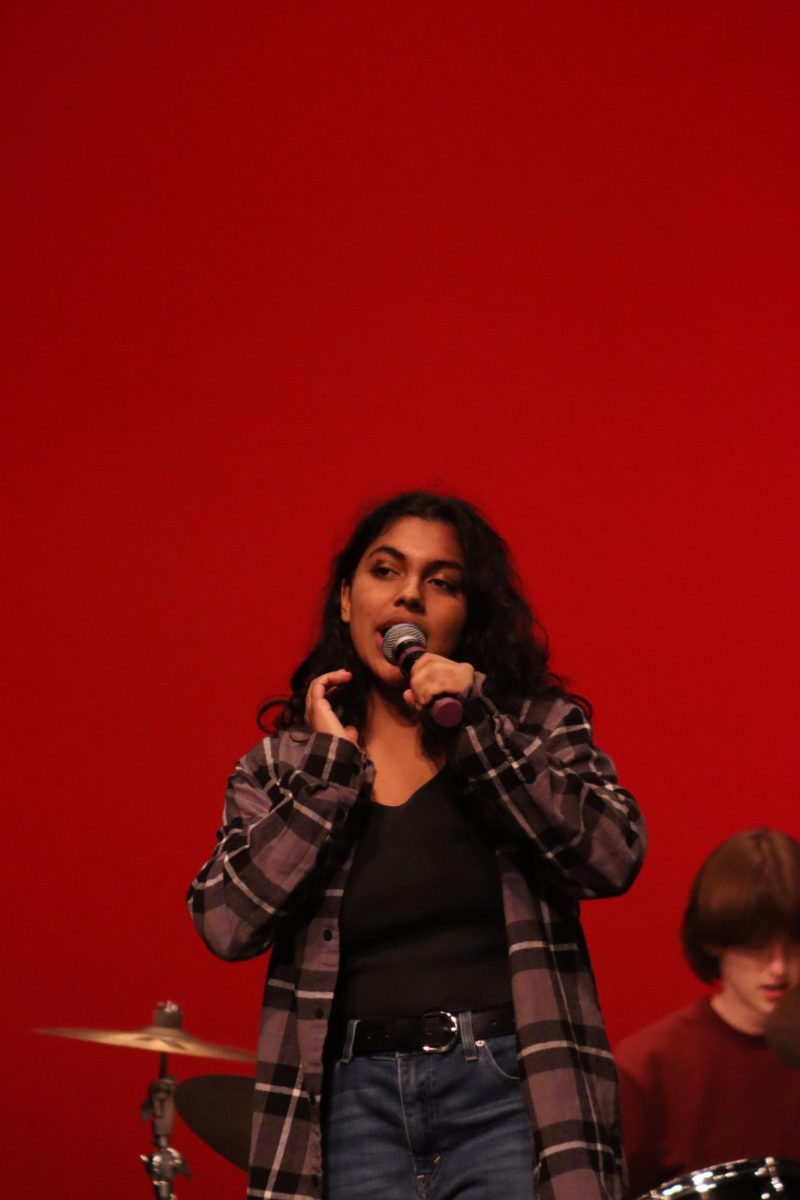 Senior Nalia Ahmed sings with her band The Neithers at a student fundraiser for Cystic Fibrosis