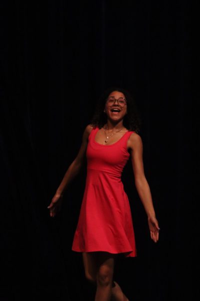 Featured dancer and senior, Isabelle Jones, sings The Acceptance Song during a rehearsal before the show.