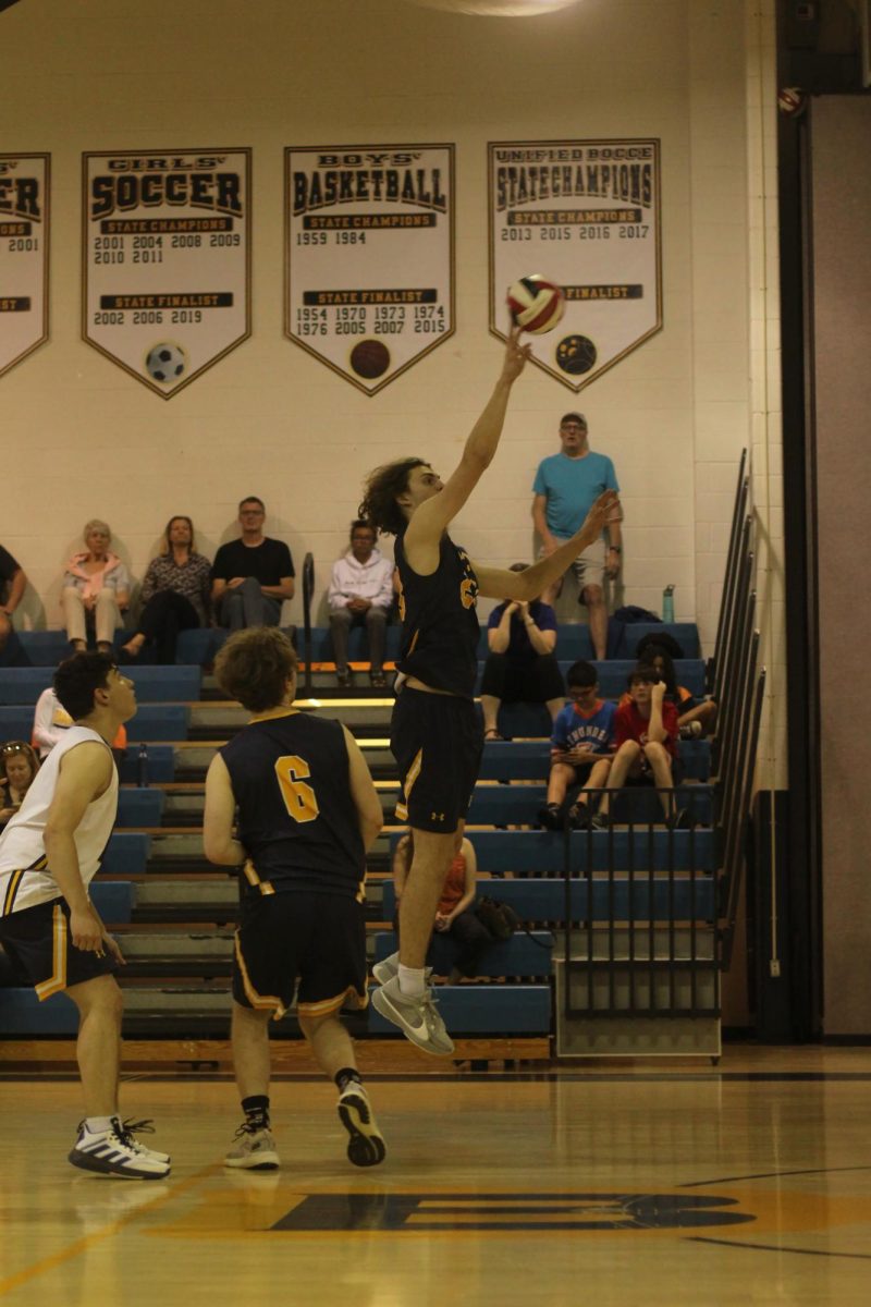 Senior Adam Strong Jacobson returns a volley to Whitman 