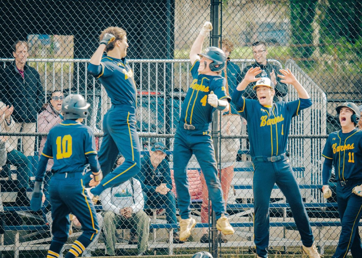The Barons celebrate an Alex Butler home run.