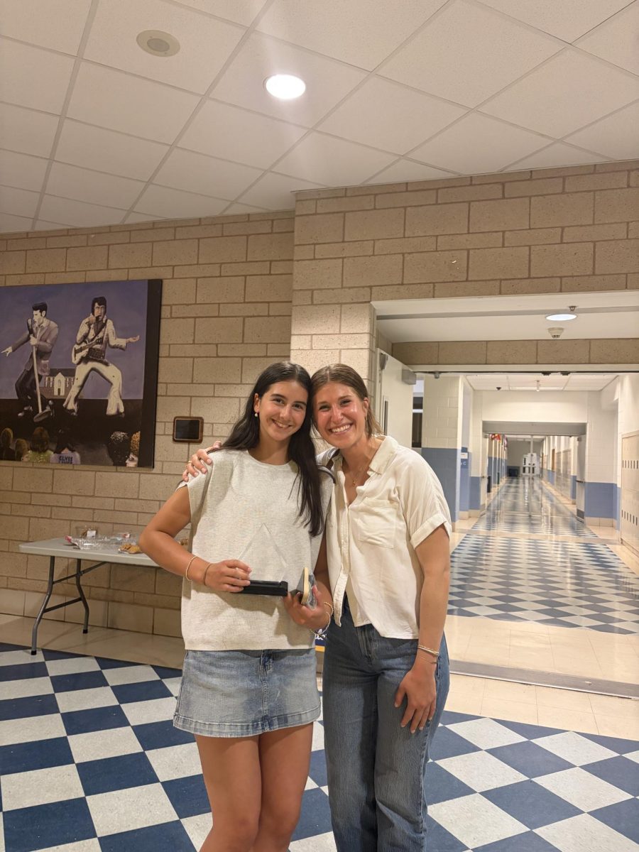 Brooke Doukouris poses with B-CC Basketball Coach Fritz (Image courtesy of @bccbaronsgb)