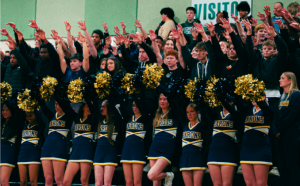 Shows an engaged student section at a B-CC boys basketball game 